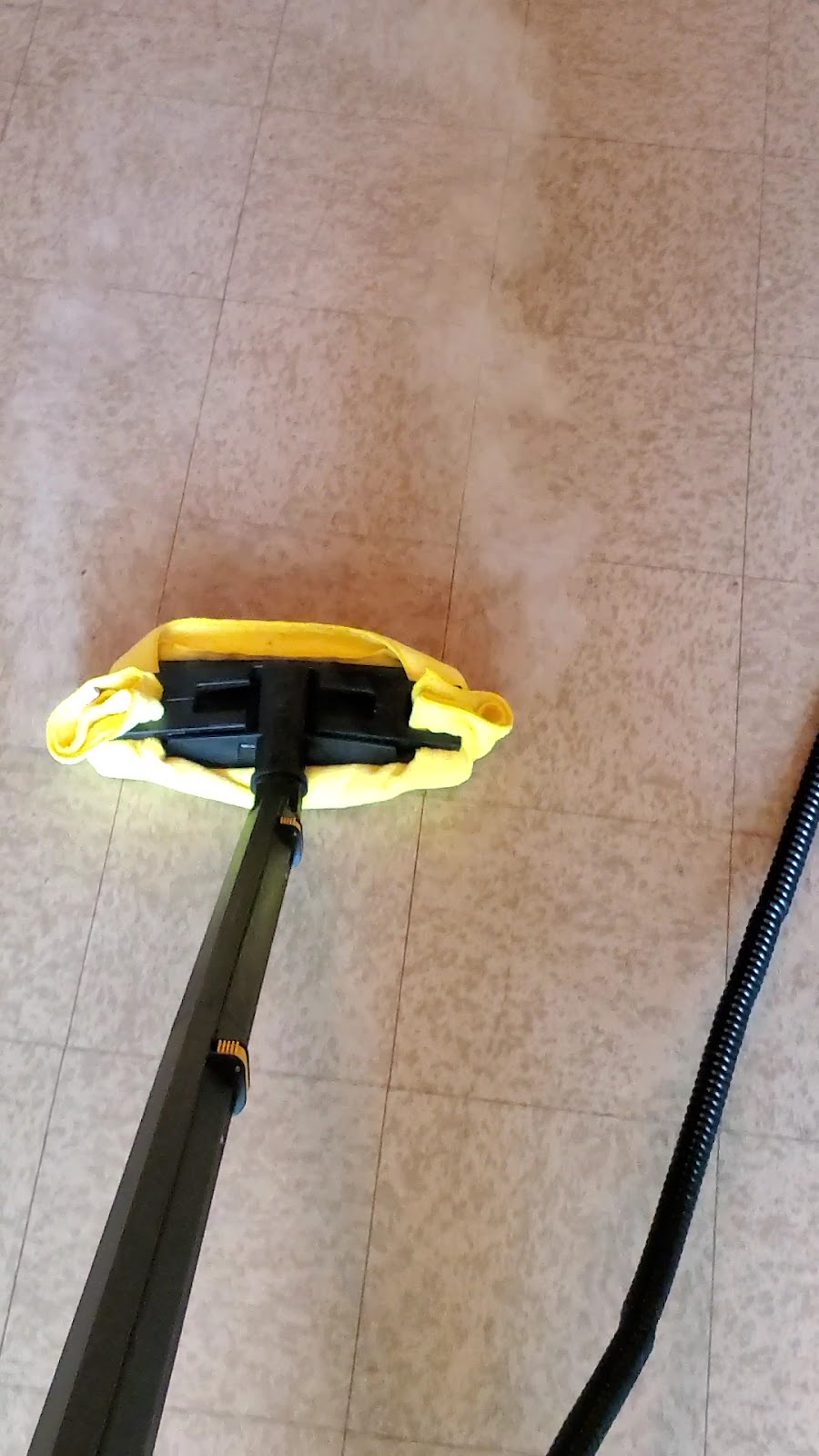 Tile floor steam cleaning by Sophisticated Cleaners in Idaho
